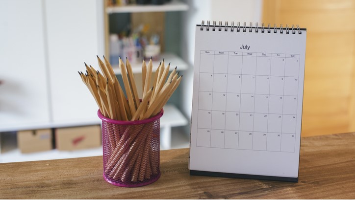End of year reflections - desk with July calendar