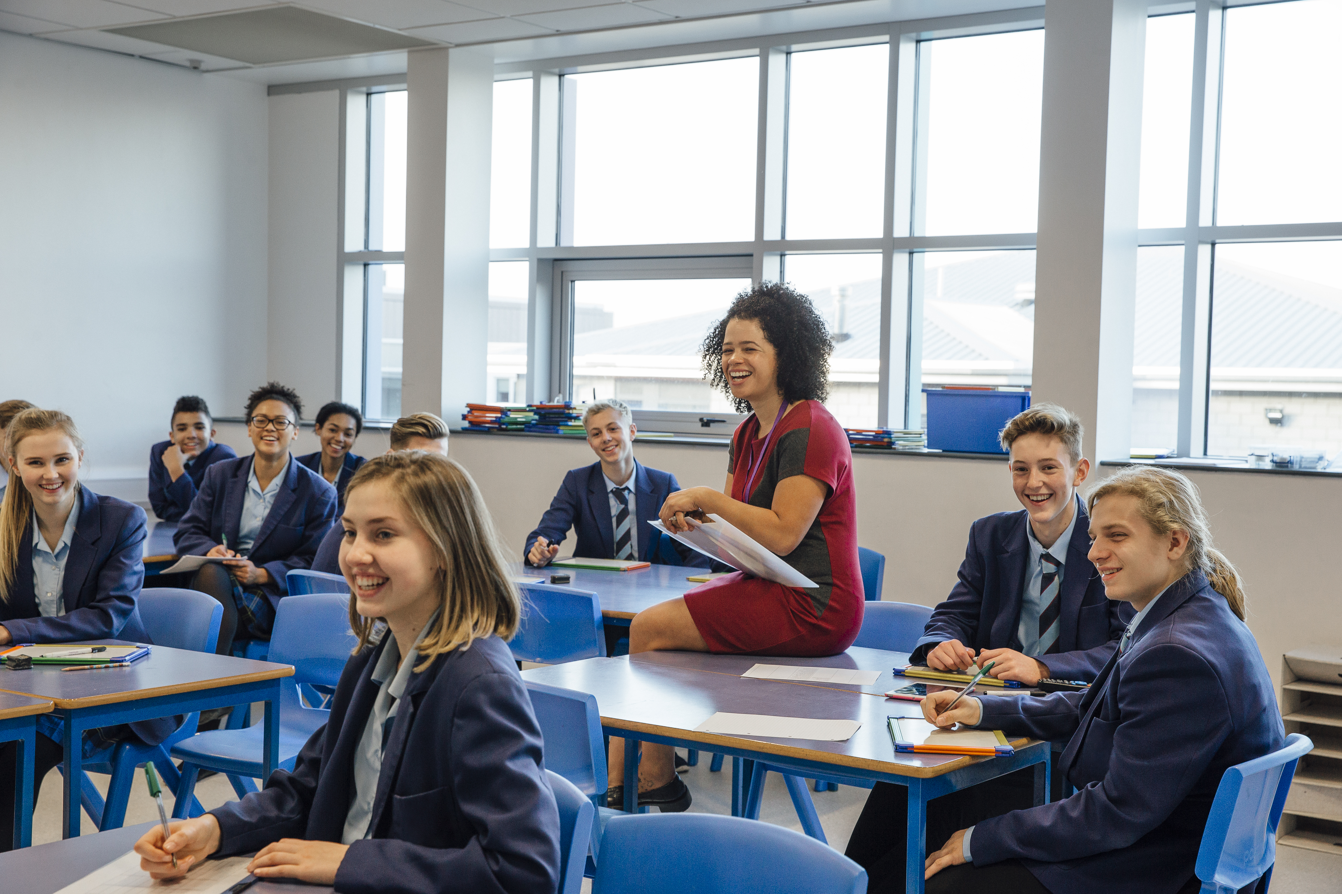 Teacher working with students in a lesson